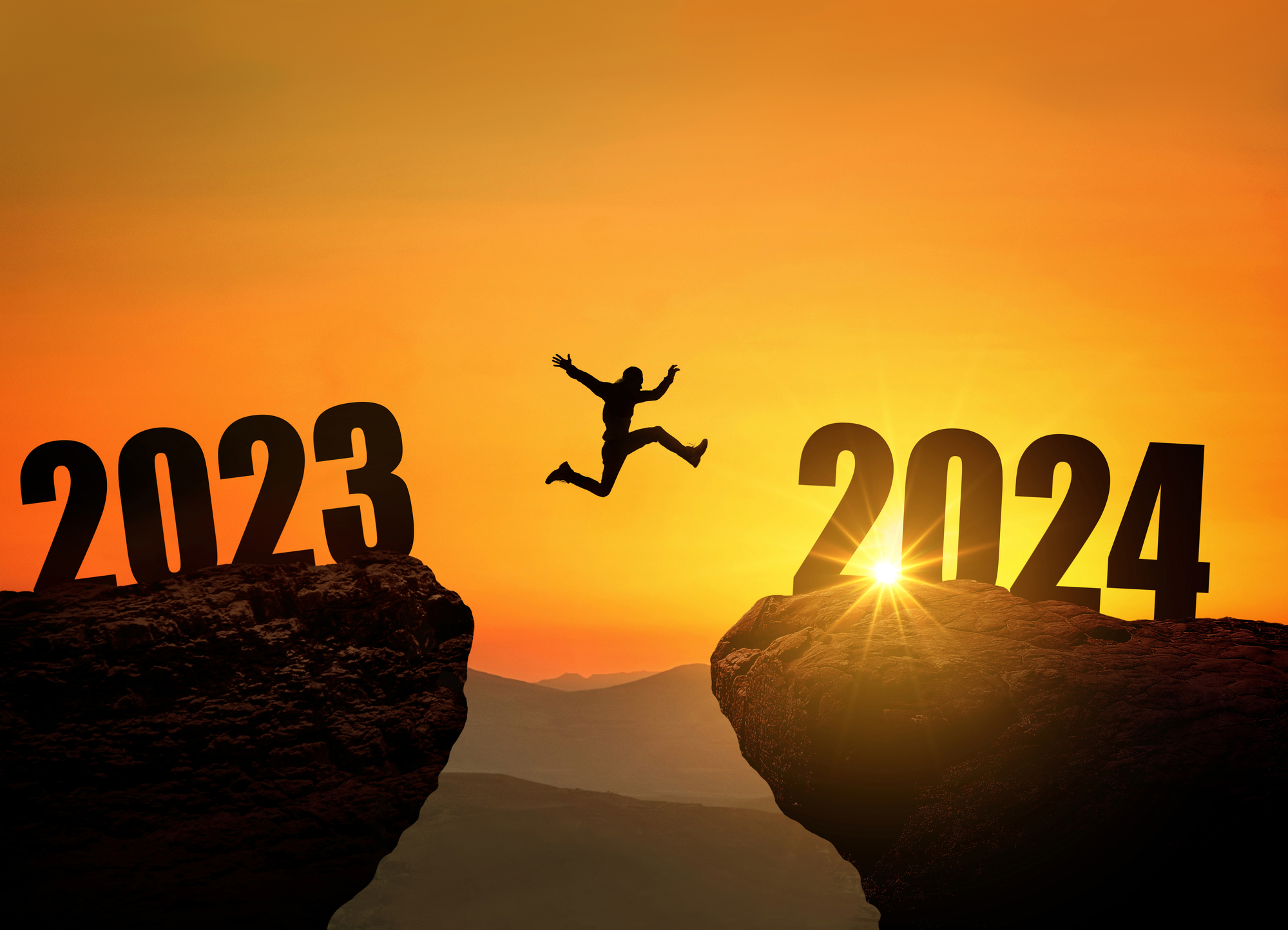 Man jumping on cliff 2024 over the precipice at amazing sunset. New Year's concept. Symbol of starting and welcome happy new year 2024. People enters the year 2024, creative idea
